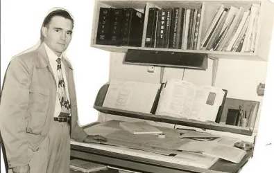 Butcher in front of desk