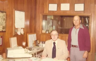photo of men working at desk