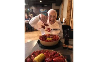 Mr. Butcher eating crawfish