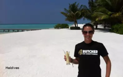 A woman wearing a Butcher AC t-shirt in Maldives