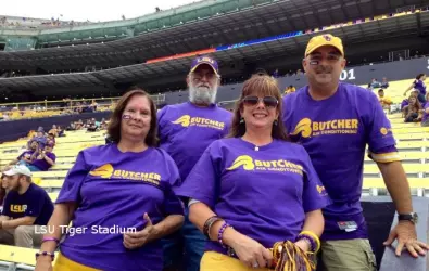 Butcher employees at an LSU game