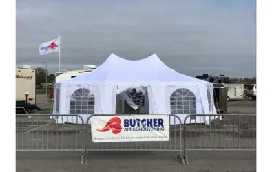 image of a Butcher AC tent at a Mardi Gras parade