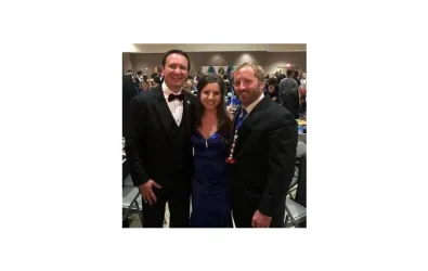 Butcher AC team members at a Mardi Gras ball