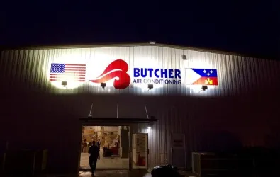 photo of the side of the company building with signage