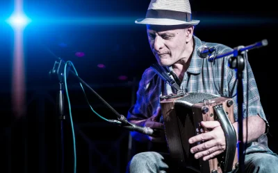 An accordion player playing traditional Cajun-style music at the KBON Cajun Music Festival.